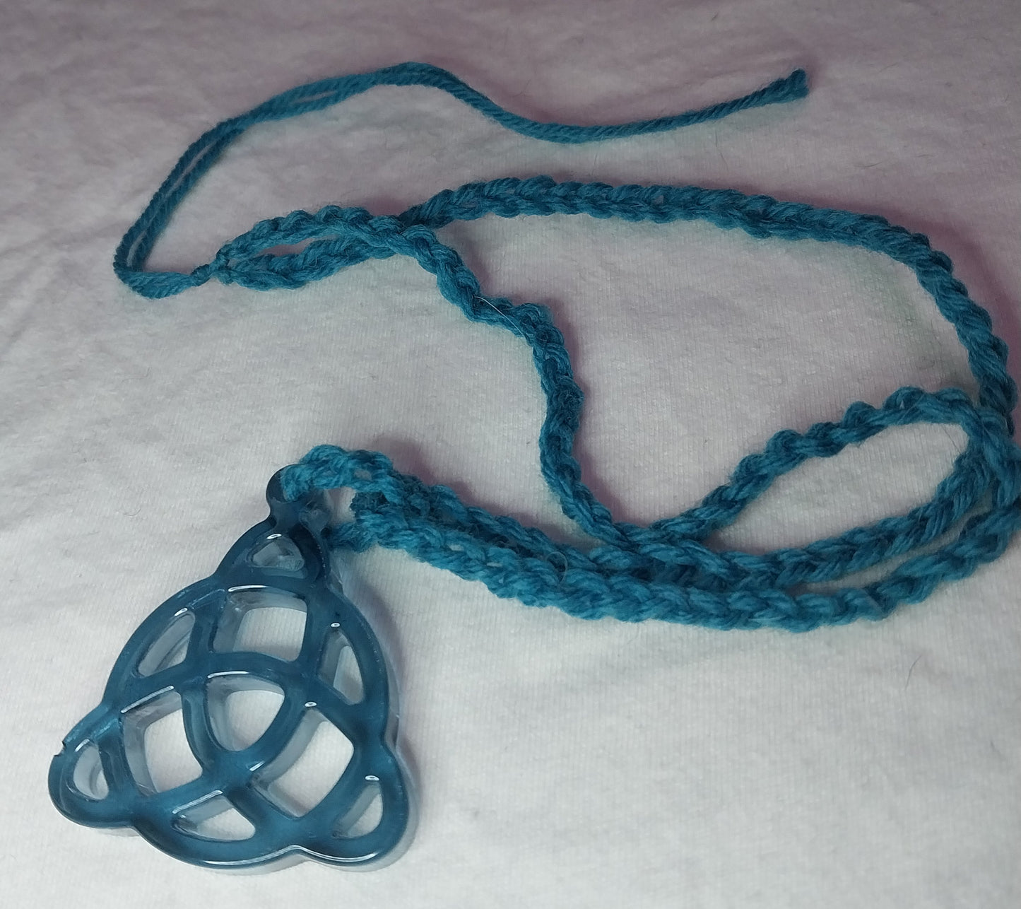 Triquetra Clear Blue Resin Necklace